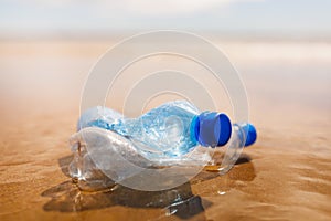 Wasted plastic bottles on beach