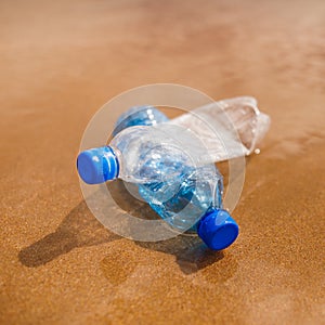 Wasted plastic bottles on beach