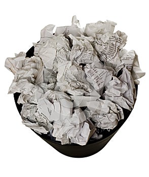 Wastepaper basket full of crumpled paper photo