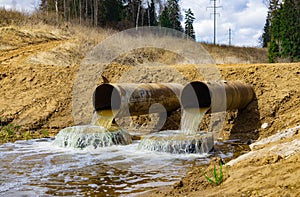 Wastewater pipes discharge waste water into the environment.