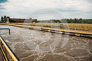 Wastewater treatment plant with tanks or reservoir for aeration and biological purification of sewage