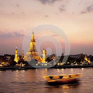 Wat Arun across Chao Phraya River during sunset