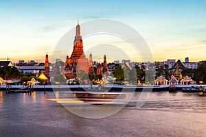 Wat Arun and Chao Phraya River with beautiful sunset sky background, Bangkok, Thailand