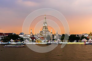 Wat Arun with Chao Phraya river at sunset in Bangkok, Thailand