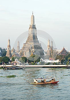 Wat Arun by Chao Phraya river in Thailand