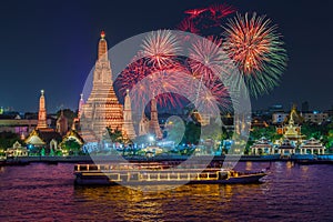 Wat arun and cruise ship in night time under new year celebration, Bangkok city ,Thailand photo