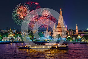 Wat arun and cruise ship in night time under new year celebration, Bangkok city ,Thailand