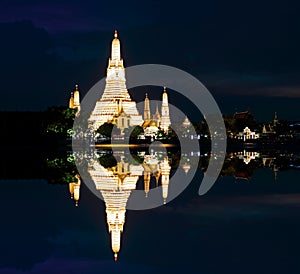 Wat Arun Ratchawararam Ratchawaramahawihan Temple of Dawn at night reflection Bangkok, Thailand photo