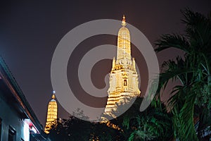 Wat arun with  roof top of the building in the night time.