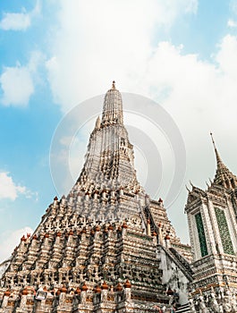 Wat Arun Temple of dawn the famous beautiful landmark in Bangkok Thailand. Wat Arun temple in a blue sky. Wat Arun is a Buddhist