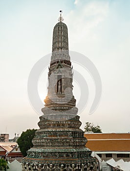 Wat Arun Temple of dawn the famous beautiful landmark in Bangkok Thailand. Wat Arun temple in a blue sky. Wat Arun is a Buddhist