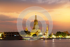 Wat Arun Temple and Chao Phraya River With sunset evening light in Bangkok Thailand