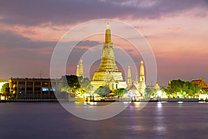 Wat Arun Temple and Chao Phraya River With sunset evening light in Bangkok Thailand