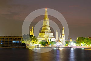 Wat Arun Temple and Chao Phraya River With sunset evening light in Bangkok Thailand