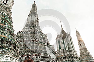 Wat Arun Temple of dawn the famous beautiful landmark in Bangkok Thailand. Wat Arun temple in a blue sky. Wat Arun is a Buddhist