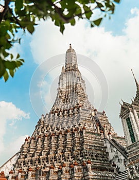 Wat Arun Temple of dawn the famous beautiful landmark in Bangkok Thailand. Wat Arun temple in a blue sky. Wat Arun is a Buddhist