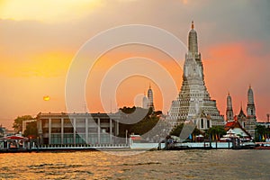 Wat Arun Temple with river sunset in Bangkok Thailand Asia