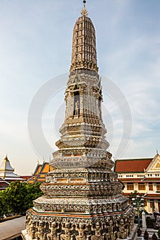 Wat Arun Temple at sunset in Bangkok Thailand. Wat Arun is a Buddhist temple in Bangkok and is one of the most famous landmarks in