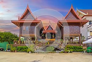 Wat Buddhist temple in Phuket Town Thailand. Decorated in colours of Gold Brown and White. Sunset Sunrise lovely sky