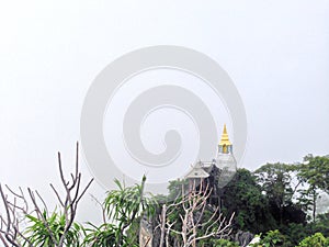 Wat Chaloem Phrakiat Phrachomklao Rachanuson at Chae hom, Lampang, Thailand. Buddhist temple and pagoda on rock mountain have clou