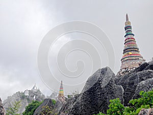 Wat Chaloem Phrakiat Phrachomklao Rachanuson at Chae hom, Lampang, Thailand. Buddhist temple and pagoda on rock mountain have clou