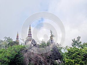 Wat Chaloem Phrakiat Phrachomklao Rachanuson at Chae hom, Lampang, Thailand. Buddhist temple and pagoda on rock mountain have clou