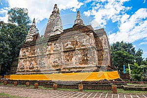 Wat Jed Yod an iconic Indian style viharn with 7 chedis on top located outskirts of Chiang Mai province of Thailand.