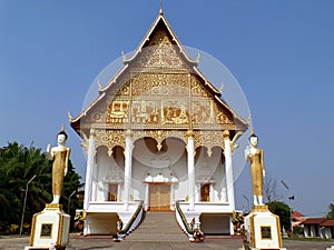 Wat That Luang Nua buddhist temple, the temple next to PhaThat Luang stupa in Vientiane, Laos photo