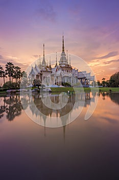 Wat Luang Pho Toh temple with water reflection in twilight time, Thailand