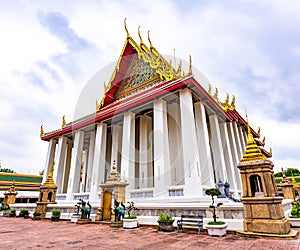 Wat Pho temple in Bangkok city, Thailand. Ancient buddhism temple, view of building with lying Buddha statue inside. Famous