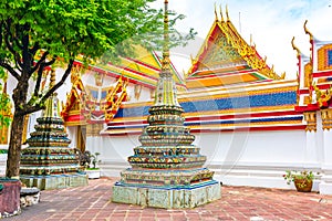 Wat Pho temple in Bangkok city, Thailand. View of pagoda and stupa in famous ancient temple. Religious buildings in buddhism style