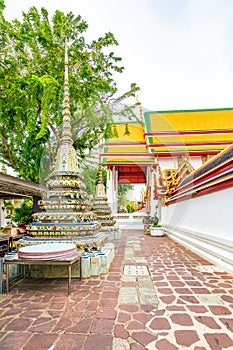 Wat Pho temple in Bangkok city, Thailand. View of pagoda and stupa in famous ancient temple. Religious buildings in buddhism style