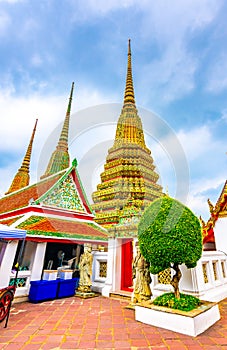 Wat Pho temple in Bangkok city, Thailand. View of pagoda and stupa in famous ancient temple. Religious buildings in buddhism style