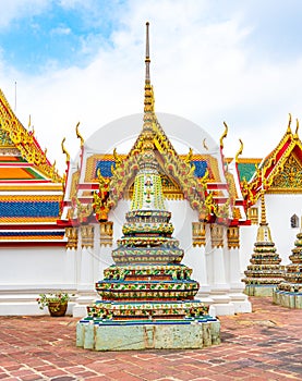 Wat Pho temple in Bangkok city, Thailand. View of pagoda and stupa in famous ancient temple. Religious buildings in buddhism style