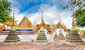 Wat Pho temple in Bangkok city, Thailand. View of pagoda and stupa in famous ancient temple. Religious buildings in buddhism style