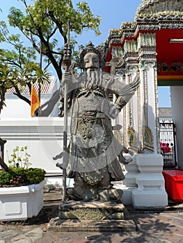 Wat Pho Thai Massage School Service Center. Another attraction of Wat Pho. Chinese stone statues adorned by arches and places.