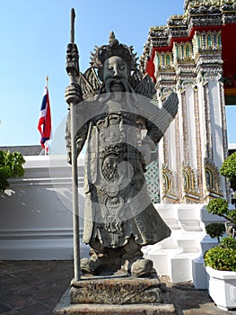 Wat Pho Thai Massage School Service Center. Another attraction of Wat Pho. Chinese stone statues adorned by arches and places.