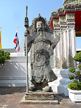 Wat Pho Thai Massage School Service Center. Another attraction of Wat Pho. Chinese stone statues adorned by arches and places.