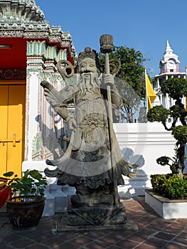 Wat Pho Thai Massage School Service Center. Another attraction of Wat Pho. Chinese stone statues adorned by arches and places.