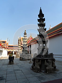 Wat Pho Thai Massage School Service Center. Another attraction of Wat Pho. Chinese stone statues adorned by arches and places.