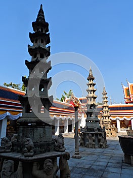 Wat Pho Thai Massage School Service Center. Another attraction of Wat Pho. Chinese stone statues adorned by arches and places.