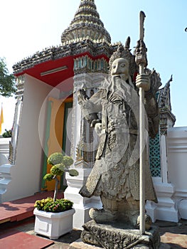 Wat Pho Thai Massage School Service Center. Another attraction of Wat Pho. Chinese stone statues adorned by arches and places.