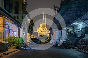 Wat Phra Chetuphon or Wat Pho, a Buddhist temple illuminated at night in Bangkok City, Thailand. Thai architecture buildings