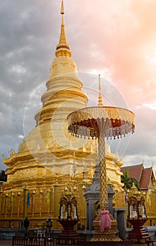 Wat Phra That Hariphunchai Pagoda with cloud at Lamphun, Thailand