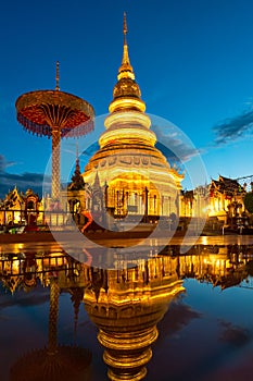 Wat Phra That Hariphunchai with water reflection in Lamphun