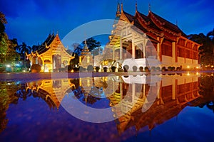 Wat Phra Sing with the water reflection after rainning, Chiang Mai, Thailand.