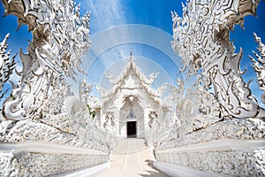 Wat Rong Khun, White temple is a contemporary unconventional Buddhist temple. photo
