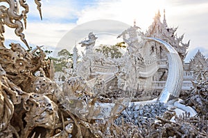 Wat Rong Khun White Temple is one of most favorite landmarks tourists visit in Thailand, built with modern contemporary unconventi