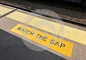 Watch The Gap warning Sign on a train platform