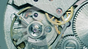 Watch mechanism gears and a mainspring